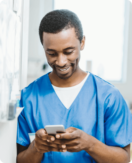 A smiling man with phone call in check shirt