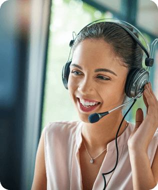 A smiling man in blue shirt looking at his phone