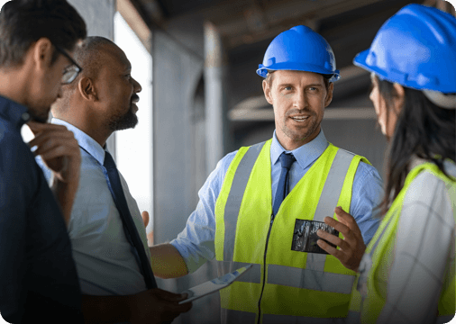 four people discussing commercial remodelling