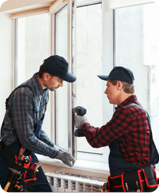 two men working to repair a window