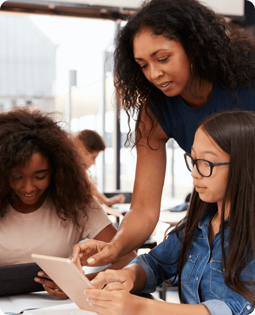 a young teacher teaching to two girls